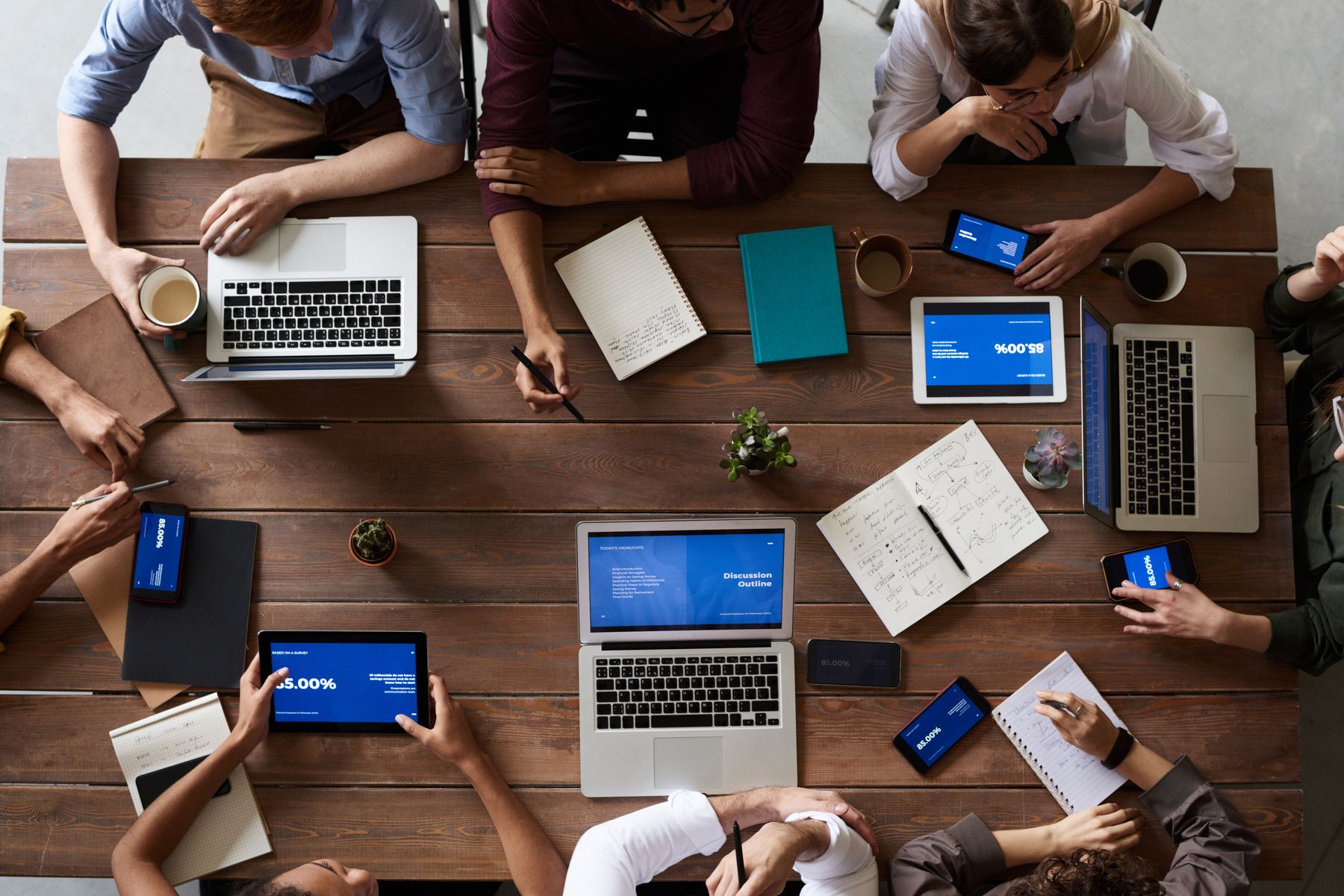 Clients and consultants collaborating at computer workstations